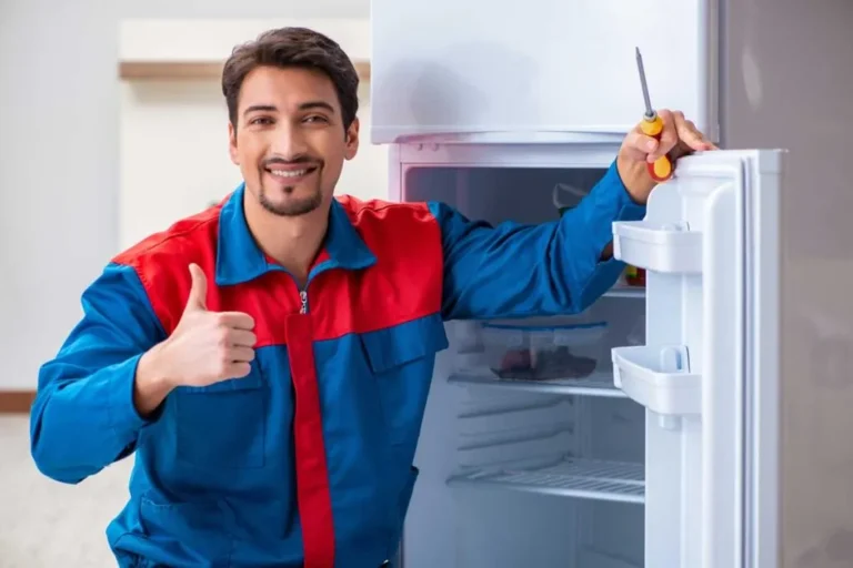 swappliancerepair professional repairing broken fridge 1024x683 optimized